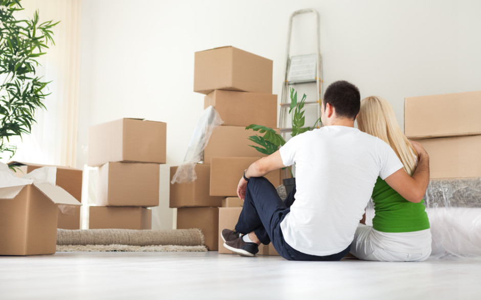 couple with moving boxes - shutterstock_154243616