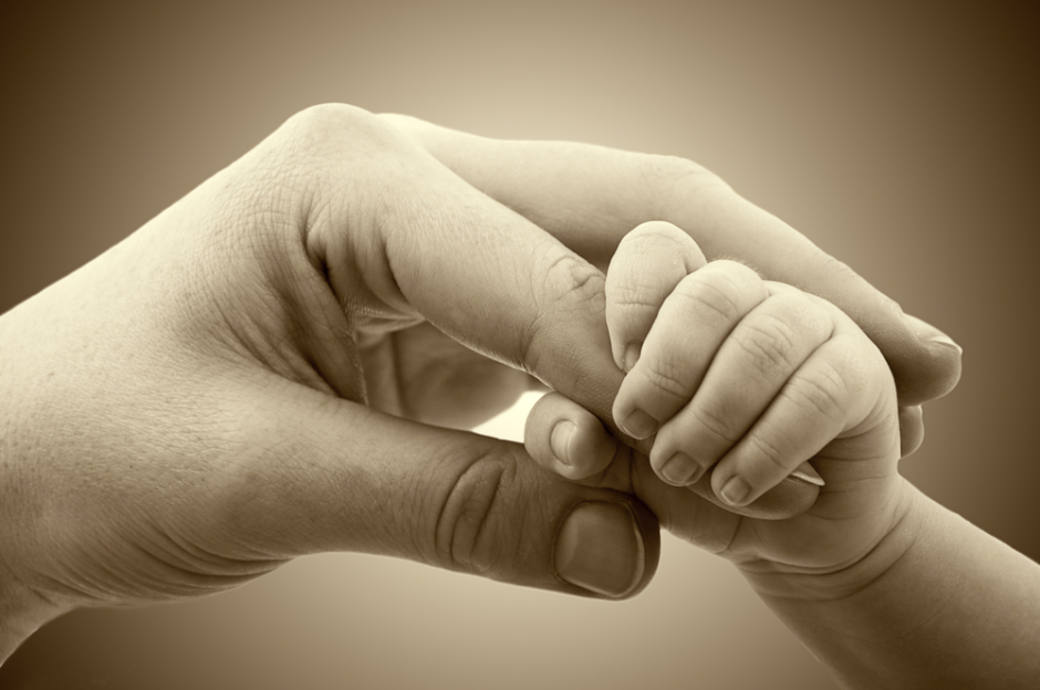 Baby and mom hand - shutterstock_126133007